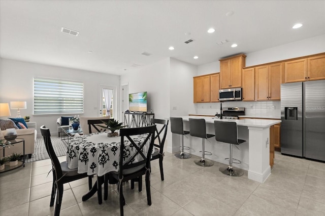 2524 Datura Loop, Saint Cloud, FL 34772 - dining space with light tile patterned floors, recessed lighting, and baseboards