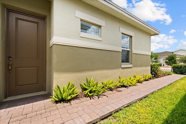 2524 Datura Loop, Saint Cloud, FL 34772 - doorway to property featuring stucco siding