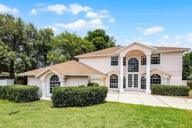 1802 Imperial Palm Dr, Apopka, FL 32712 - view of front of house with stucco siding, a garage, french doors, driveway, and a shingled roof