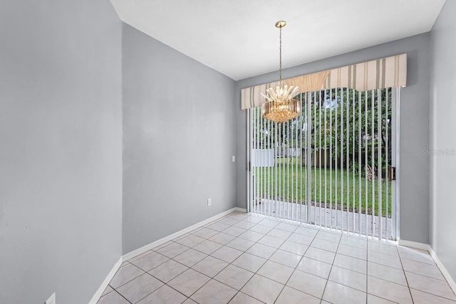 1802 Imperial Palm Dr, Apopka, FL 32712 - unfurnished dining area featuring a chandelier, light tile patterned floors, and baseboards
