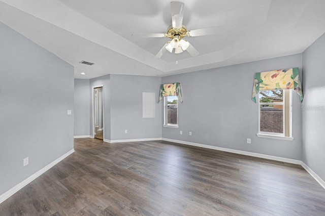 1802 Imperial Palm Dr, Apopka, FL 32712 - unfurnished room with a raised ceiling, baseboards, dark wood-type flooring, and a ceiling fan