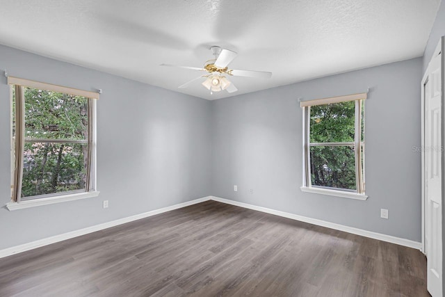 1802 Imperial Palm Dr, Apopka, FL 32712 - unfurnished room with dark wood-type flooring, a ceiling fan, and baseboards