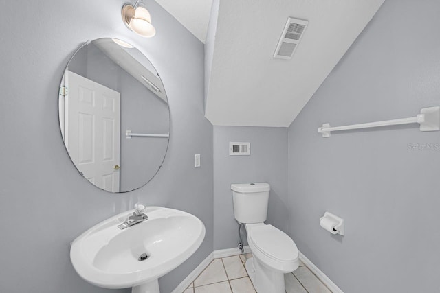 1802 Imperial Palm Dr, Apopka, FL 32712 - half bath with a sink, tile patterned floors, toilet, vaulted ceiling, and baseboards