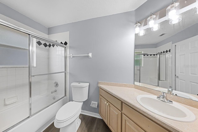1802 Imperial Palm Dr, Apopka, FL 32712 - bathroom with wood finished floors, toilet, vanity, enclosed tub / shower combo, and baseboards
