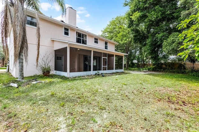 1802 Imperial Palm Dr, Apopka, FL 32712 - back of house with a sunroom, a chimney, and stucco siding