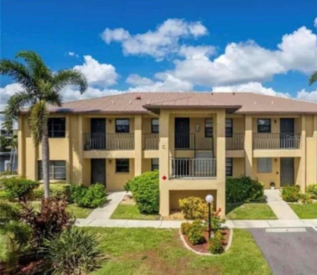 3221 White Ibis Ct Unit C1, Punta Gorda, FL 33950 - view of building exterior featuring a garage