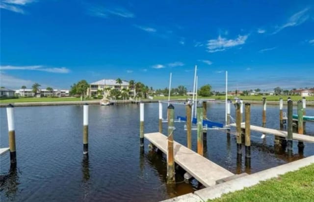 3221 White Ibis Ct Unit C1, Punta Gorda, FL 33950 - dock with a water view and boat lift