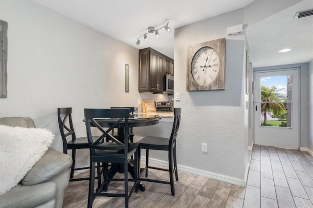 3221 White Ibis Ct Unit C1, Punta Gorda, FL 33950 - dining area with wood finish floors and baseboards