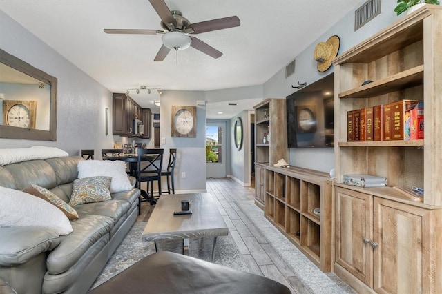 3221 White Ibis Ct Unit C1, Punta Gorda, FL 33950 - living area with ceiling fan, baseboards, and light wood-type flooring