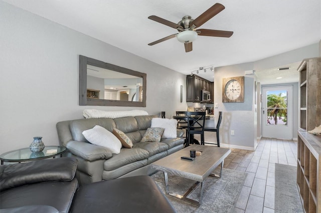 3221 White Ibis Ct Unit C1, Punta Gorda, FL 33950 - living area featuring ceiling fan, wood finish floors, and baseboards