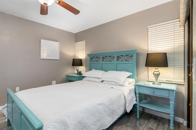 3221 White Ibis Ct Unit C1, Punta Gorda, FL 33950 - bedroom featuring dark wood-style flooring, ceiling fan, and baseboards