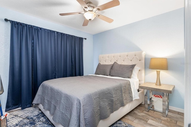 3221 White Ibis Ct Unit C1, Punta Gorda, FL 33950 - bedroom with wood finished floors, baseboards, and a ceiling fan