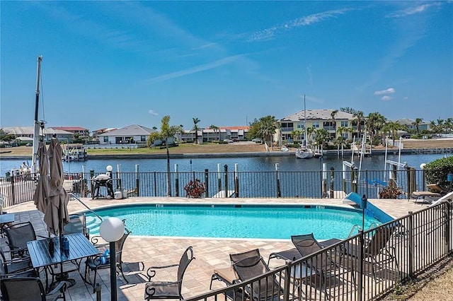 3221 White Ibis Ct Unit C1, Punta Gorda, FL 33950 - community pool featuring a patio area, fence, a water view, and a residential view