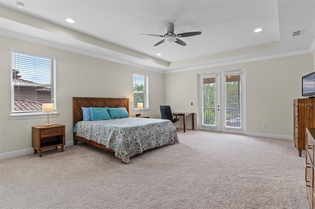10819 Savona Way, Orlando, FL 32827 - bedroom featuring a tray ceiling, access to outside, baseboards, light carpet, and recessed lighting