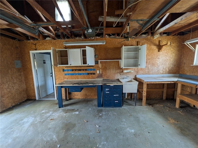 4299 Bullard St, North Port, FL 34287 - garage with a workshop area and a sink