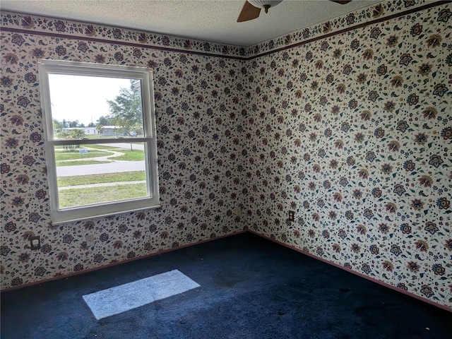 4299 Bullard St, North Port, FL 34287 - carpeted empty room with wallpapered walls, a textured ceiling, a ceiling fan, and baseboards