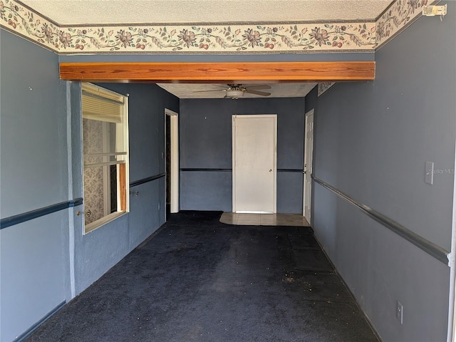 4299 Bullard St, North Port, FL 34287 - hall featuring a textured ceiling and dark colored carpet