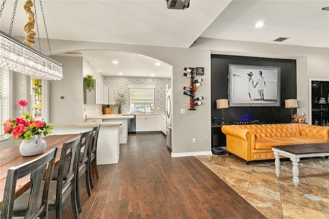 2623 Gables Dr, Eustis, FL 32726 - living room featuring arched walkways, dark wood-style floors, and recessed lighting