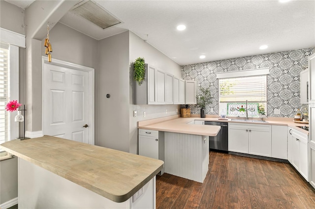 2623 Gables Dr, Eustis, FL 32726 - kitchen featuring a peninsula, dishwasher, dark wood finished floors, recessed lighting, and white cabinets
