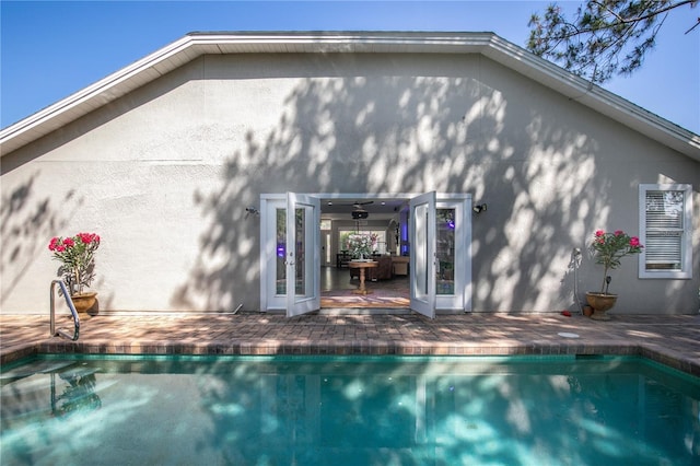 2623 Gables Dr, Eustis, FL 32726 - back of house featuring stucco siding, an outdoor pool, and a patio area