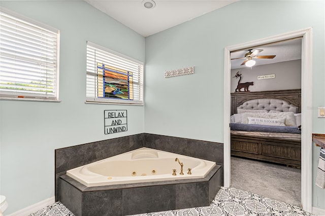 2623 Gables Dr, Eustis, FL 32726 - ensuite bathroom featuring a tub with jets, ceiling fan, toilet, and vanity