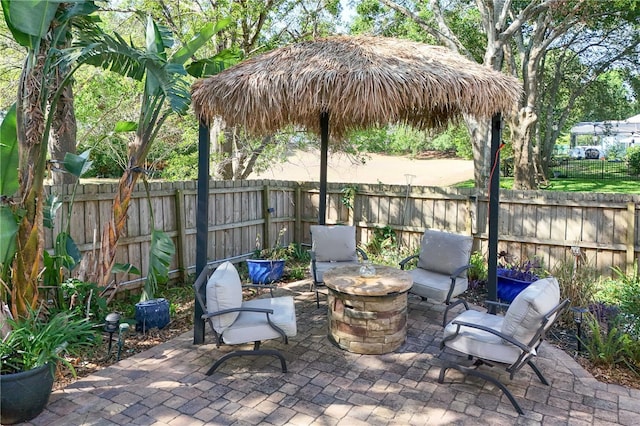 2623 Gables Dr, Eustis, FL 32726 - fenced backyard with a patio area and a fire pit