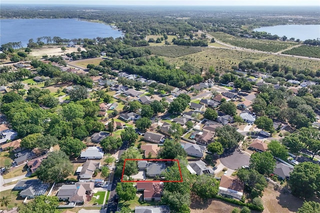 2623 Gables Dr, Eustis, FL 32726 - aerial perspective of suburban area with a large body of water and property boundaries highlighted