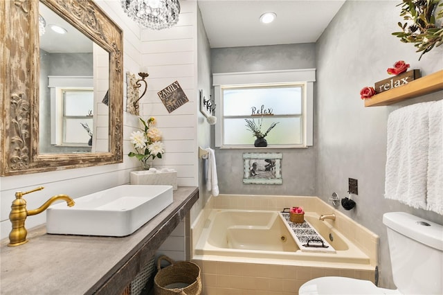 2623 Gables Dr, Eustis, FL 32726 - bathroom with a tub with jets, toilet, and vanity