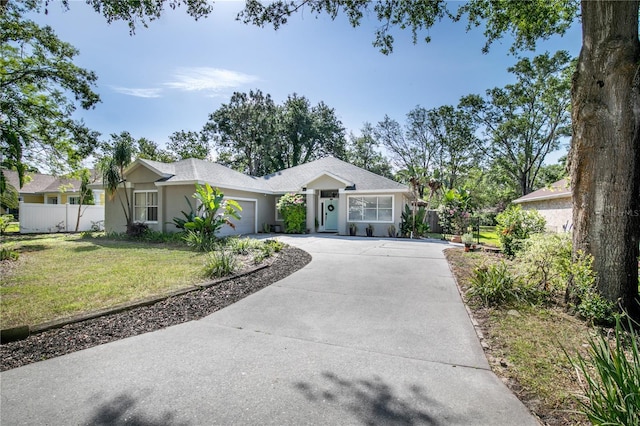 2623 Gables Dr, Eustis, FL 32726 - ranch-style house with a garage, concrete driveway, and stucco siding