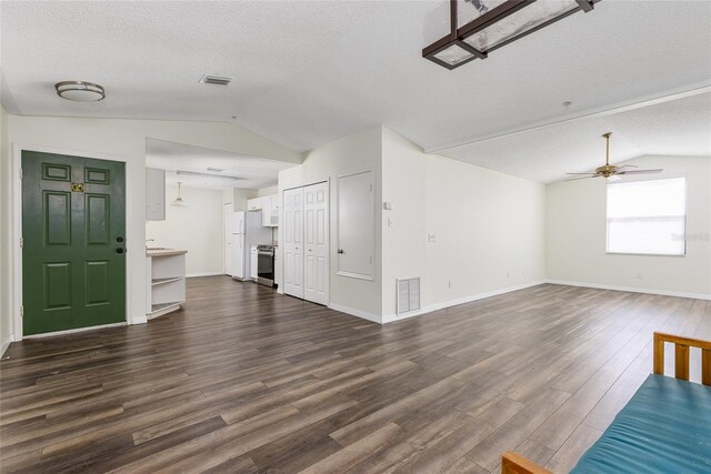 520 Via Verona Ln Unit 202, Altamonte Springs, FL 32714 - unfurnished living room with vaulted ceiling, dark wood-type flooring, ceiling fan, a textured ceiling, and baseboards