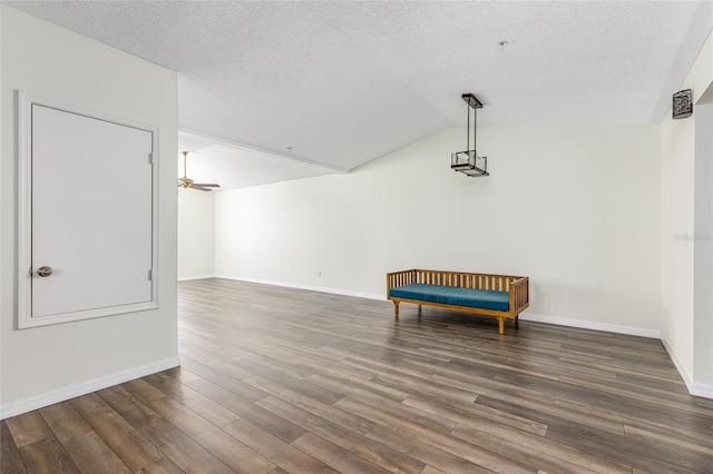 520 Via Verona Ln Unit 202, Altamonte Springs, FL 32714 - unfurnished room featuring wood finished floors, vaulted ceiling, baseboards, a textured ceiling, and ceiling fan