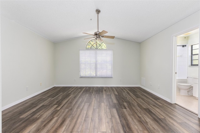 520 Via Verona Ln Unit 202, Altamonte Springs, FL 32714 - spare room featuring ceiling fan, dark wood-type flooring, lofted ceiling, and baseboards