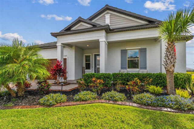 31840 Magna Gulf Loop, San Antonio, FL 33576 - view of front of house with stucco siding and a front lawn