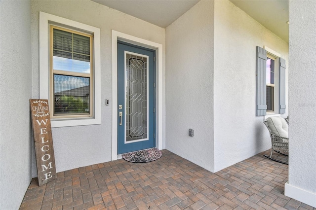 31840 Magna Gulf Loop, San Antonio, FL 33576 - doorway to property featuring stucco siding