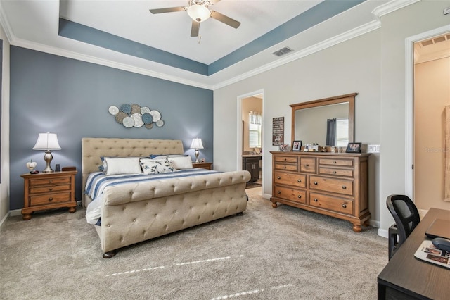 31840 Magna Gulf Loop, San Antonio, FL 33576 - carpeted bedroom featuring ornamental molding, connected bathroom, a desk, a raised ceiling, and baseboards