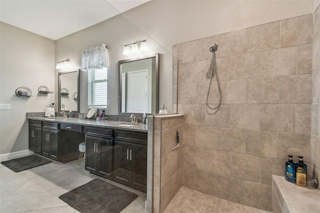 31840 Magna Gulf Loop, San Antonio, FL 33576 - full bathroom with a tile shower, tile patterned floors, double vanity, and baseboards