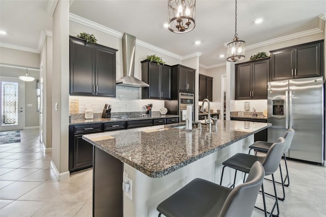 31840 Magna Gulf Loop, San Antonio, FL 33576 - kitchen featuring appliances with stainless steel finishes, wall chimney exhaust hood, a sink, dark stone countertops, and tasteful backsplash