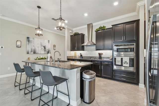 31840 Magna Gulf Loop, San Antonio, FL 33576 - kitchen with wall chimney range hood, a sink, dark stone countertops, stainless steel appliances, and a kitchen bar