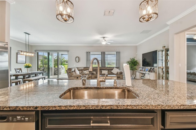 31840 Magna Gulf Loop, San Antonio, FL 33576 - kitchen with a sink, open floor plan, a chandelier, ornamental molding, and stone countertops