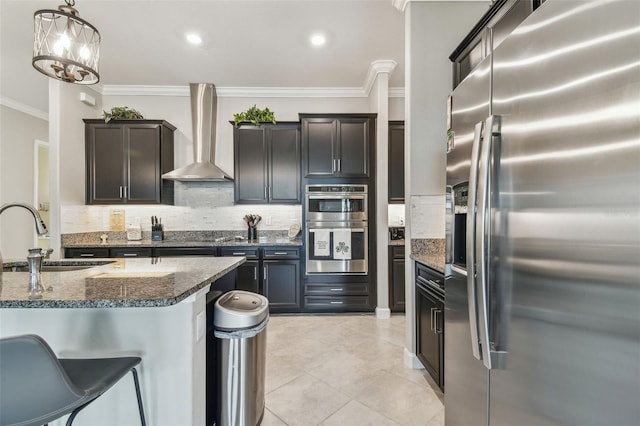 31840 Magna Gulf Loop, San Antonio, FL 33576 - kitchen featuring stainless steel appliances, a sink, wall chimney exhaust hood, backsplash, and crown molding