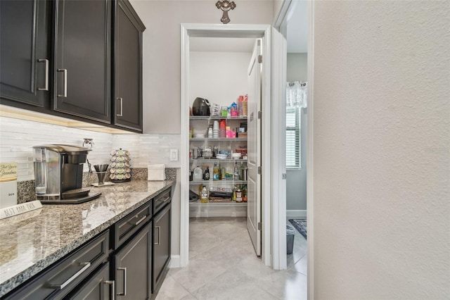 31840 Magna Gulf Loop, San Antonio, FL 33576 - bar area with decorative backsplash and light tile patterned flooring