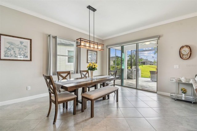 31840 Magna Gulf Loop, San Antonio, FL 33576 - dining room with healthy amount of natural light, crown molding, baseboards, and light tile patterned floors
