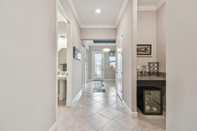 31840 Magna Gulf Loop, San Antonio, FL 33576 - entrance foyer featuring crown molding, light tile patterned flooring, and baseboards