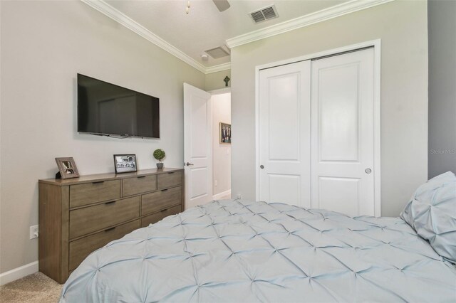 31840 Magna Gulf Loop, San Antonio, FL 33576 - carpeted bedroom with a closet, ornamental molding, and baseboards