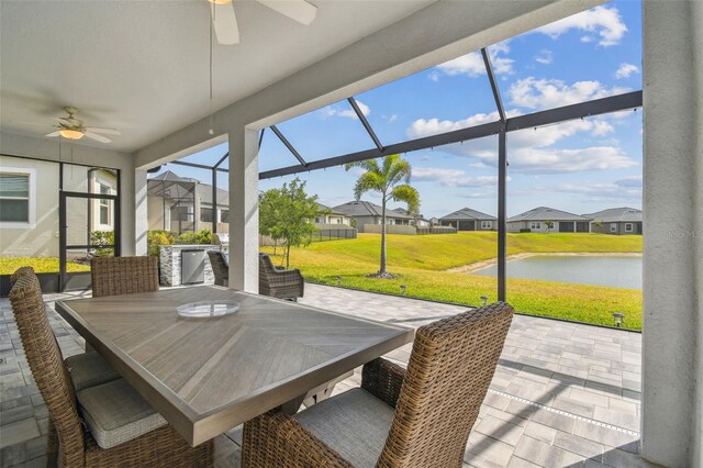 31840 Magna Gulf Loop, San Antonio, FL 33576 - sunroom featuring a ceiling fan and a residential view