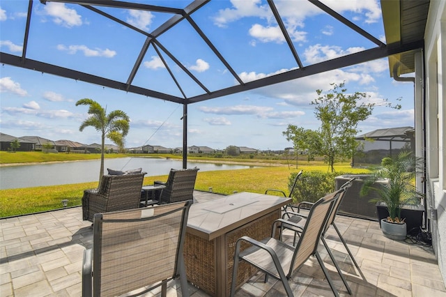 31840 Magna Gulf Loop, San Antonio, FL 33576 - view of patio with a water view, glass enclosure, and outdoor dining space