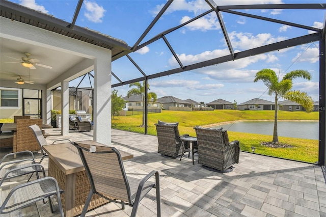 31840 Magna Gulf Loop, San Antonio, FL 33576 - view of patio featuring a water view, glass enclosure, and a ceiling fan