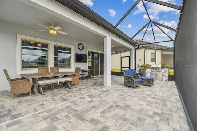 31840 Magna Gulf Loop, San Antonio, FL 33576 - sunroom featuring a ceiling fan, outdoor dining space, and an outdoor kitchen