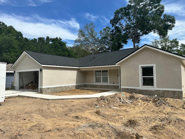 3082 SE 140th Ln, Summerfield, FL 34491 - single story home featuring stone siding, stucco siding, and a garage