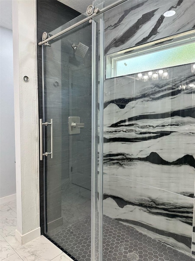 3082 SE 140th Ln, Summerfield, FL 34491 - bathroom featuring a stall shower, marble finish floor, and baseboards